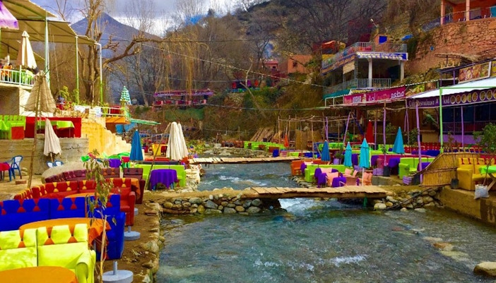 Colorful riverside cafes in Ourika Valley, Atlas Mountains, Morocco.