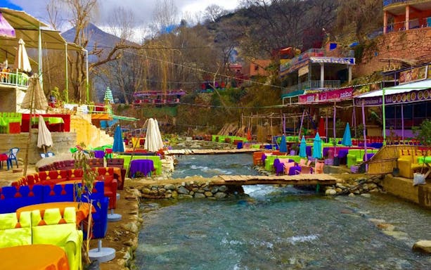 Colorful riverside cafes in Ourika Valley, Atlas Mountains, Morocco.