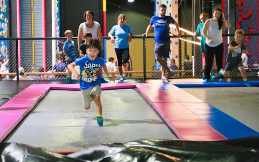 Children playing on trampolines at BOUNCE Thailand, The EmQuartier.