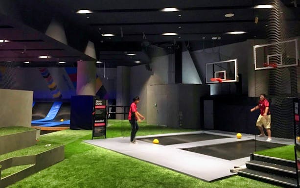 Indoor trampoline park with basketball hoops at BOUNCE Thailand, The EmQuartier.