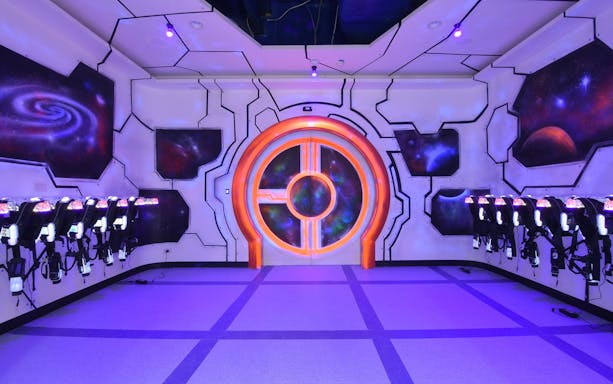 Laser tag arena with neon lights and space-themed decor at Playsquare Laser Tag, Central World.