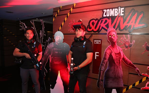 Participants in VR zombie game at Zero Latency Bangkok.