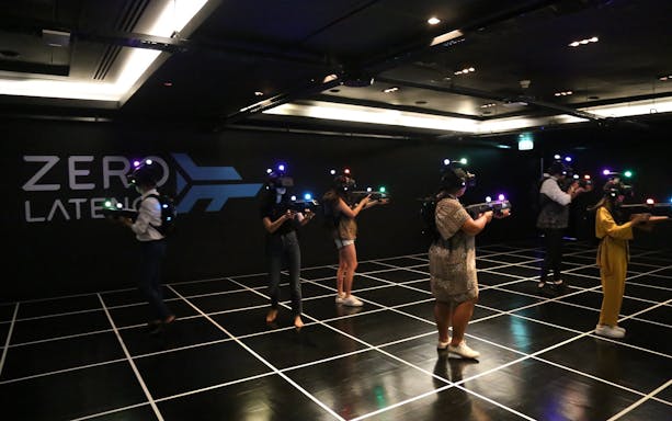 Participants engaging in VR game at Zero Latency Bangkok.