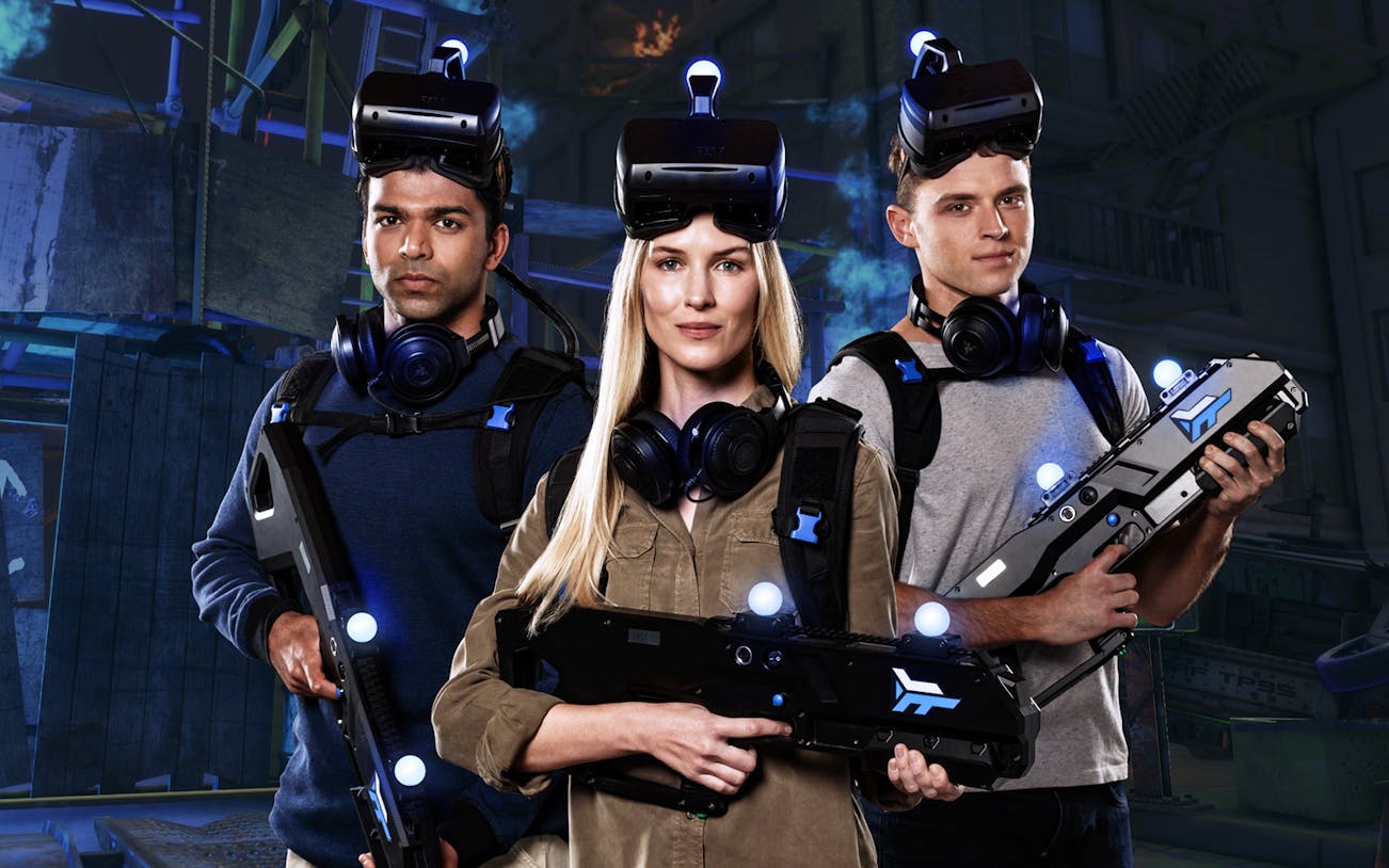 Participants in VR gear at Zero Latency Bangkok experience game.