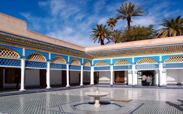 Bahia Palace courtyard with fountain and arches, Marrakesh tour.