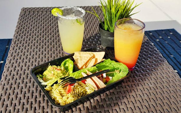 Food and drinks served on Cabo San Lucas sunset cruise table.