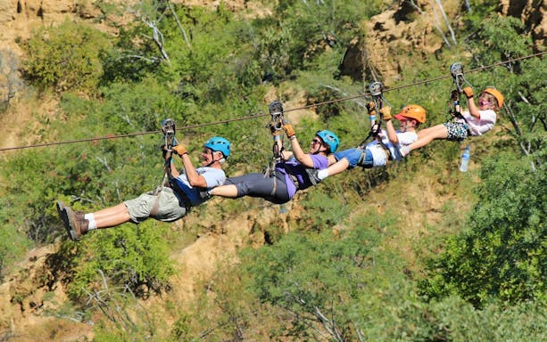 Group ziplining over a canyon in Los Cabos during the Monster Ziplines & Canyon Bridge Tour.