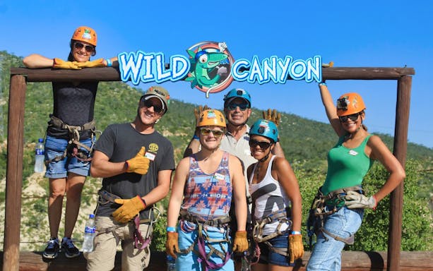 Group of people in harnesses at Wild Canyon, Los Cabos, ready for Monster Ziplines tour.