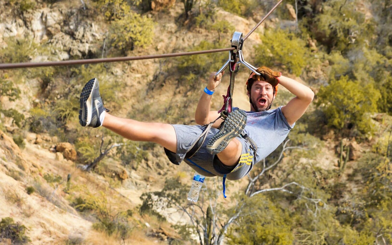 Person ziplining over a canyon in Los Cabos during the Monster Ziplines tour.