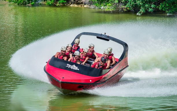 Visitors enjoying a speedboat ride at Xavage Park, Mexico.