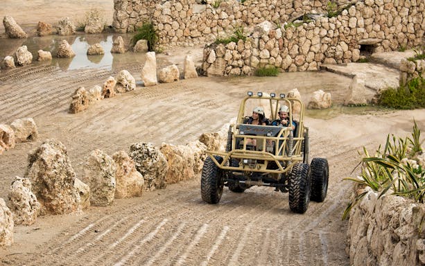 Off-road vehicle navigating rocky terrain at Xavage Park.