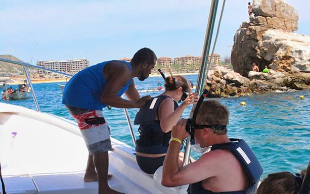 Snorkelers exploring vibrant marine life in Cabo San Lucas's Aquarium of the World.