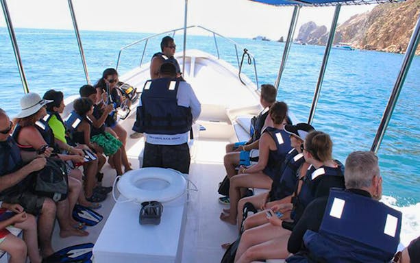 Snorkelers exploring vibrant marine life in Cabo San Lucas's Aquarium of the World.