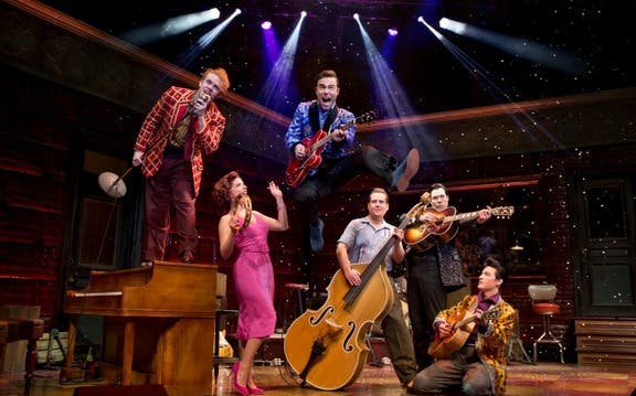 Musicians performing on stage in Million Dollar Quartet show