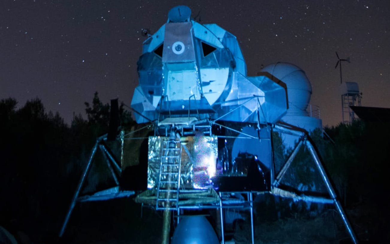 Mallorca Planetarium Observatory under starry night sky.