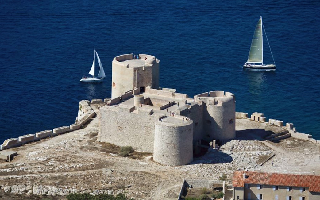 Château d’If fortress with sailboats in the Mediterranean Sea, Marseille, France.