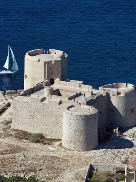Château d’If fortress with sailboats in the Mediterranean Sea, Marseille, France.