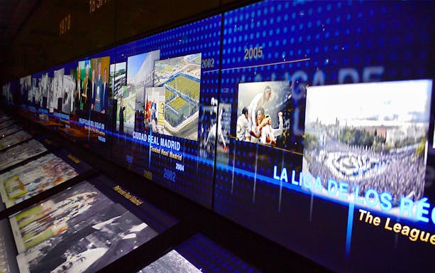 Santiago Bernabéu Stadium museum exhibit showcasing Real Madrid's history and achievements.