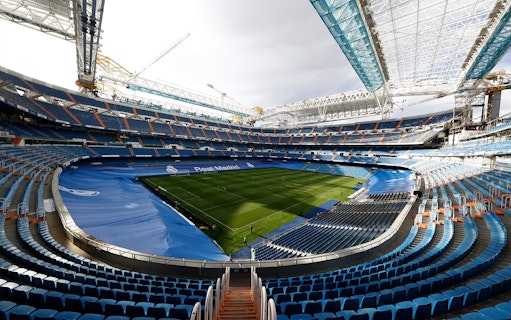 Santiago Bernabéu Stadium interior with empty seats and view of the pitch, Madrid.