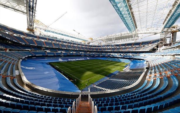 Santiago Bernabéu Stadium interior with empty seats and view of the pitch, Madrid.