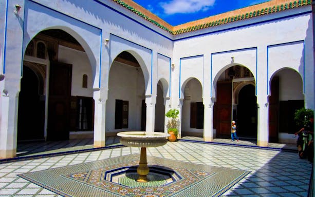 Courtyard of Bahia Palace in Marrakesh with central fountain.