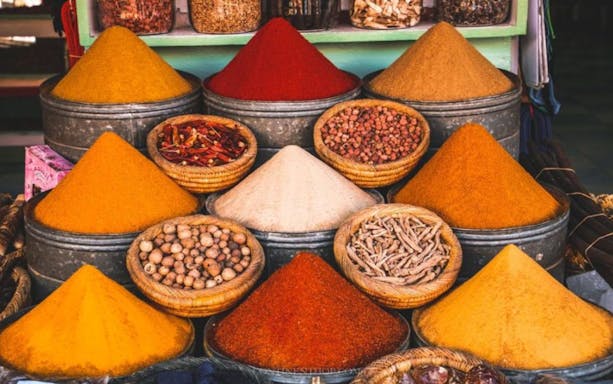 Spices displayed in Marrakesh souk during Medina guided tour.