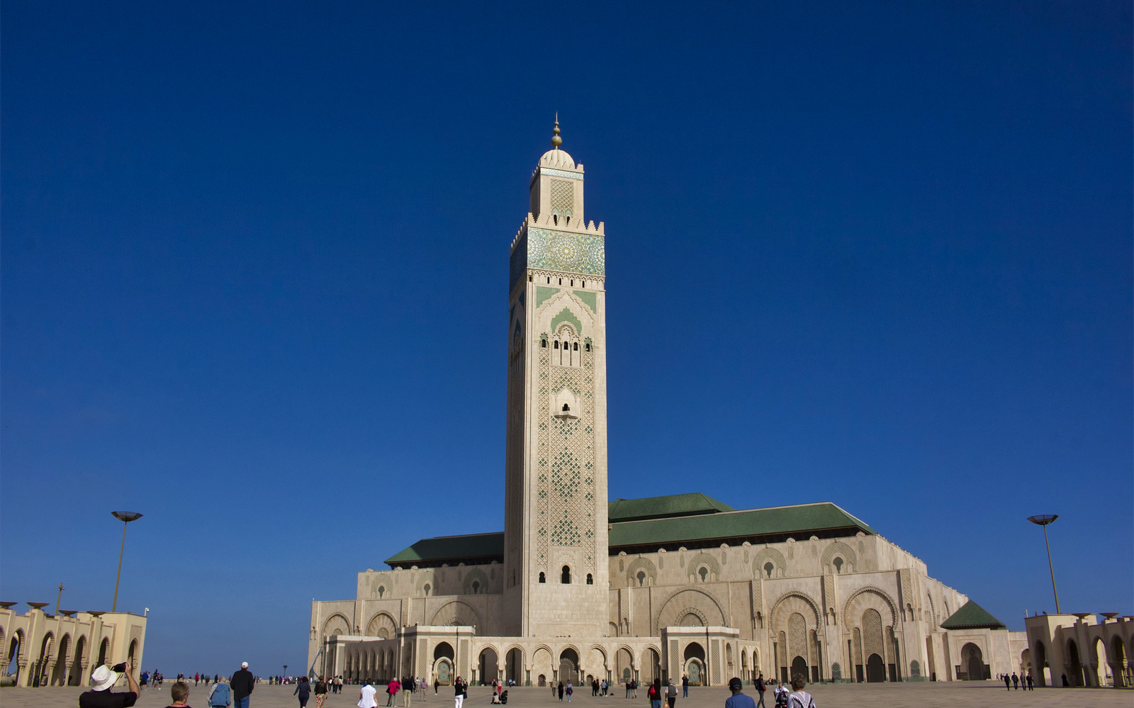 Koutoubia Mosque in Marrakesh with its tall minaret against a clear blue sky.