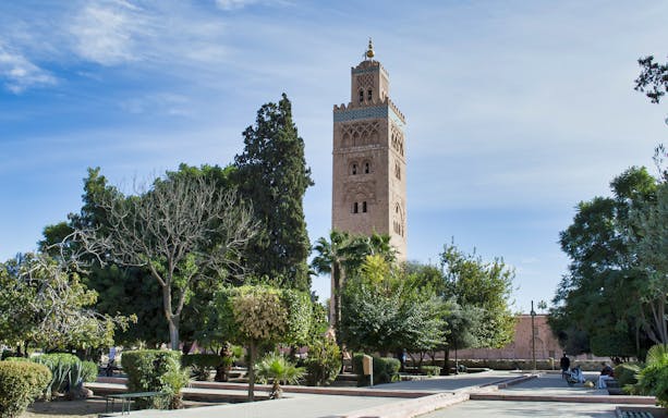 Koutoubia Mosque tower surrounded by gardens in Marrakesh, Morocco.