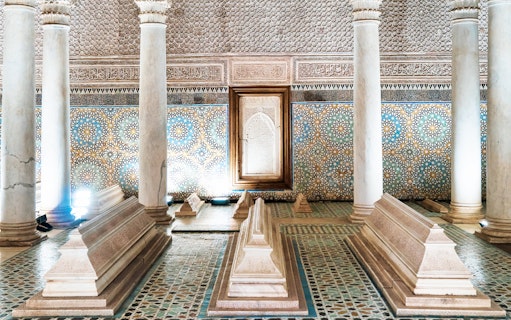 Saadian Tombs interior with ornate tilework and marble columns in Marrakesh.