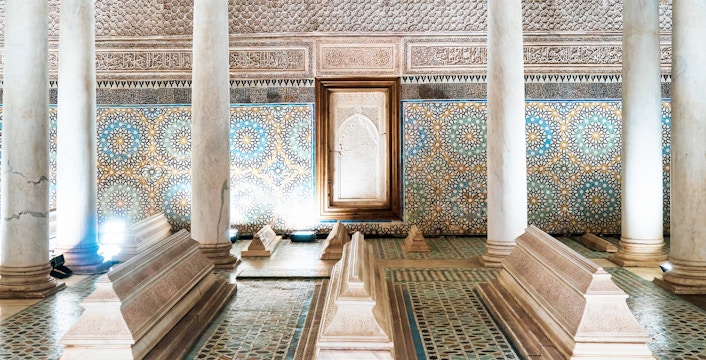 Saadian Tombs interior with ornate tilework and marble columns in Marrakesh.