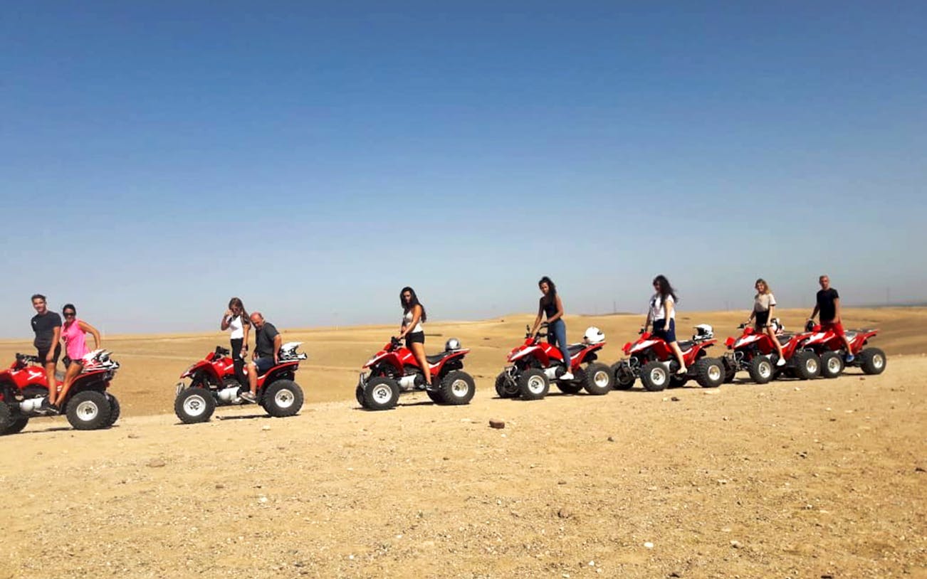 Group quad biking in Agafay Desert near Marrakesh.