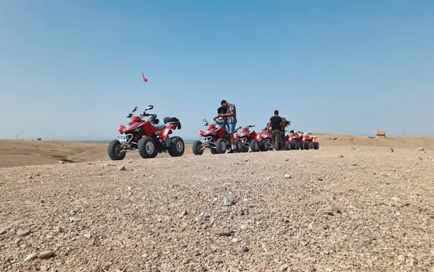 Quad bikes lined up in Agafay Desert for a tour from Marrakesh.