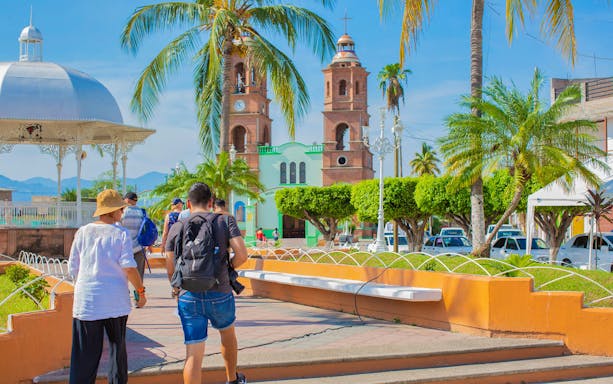 Tourists on an outdoor adventure truck exploring Banderas Bay jungle in Puerto Vallarta.