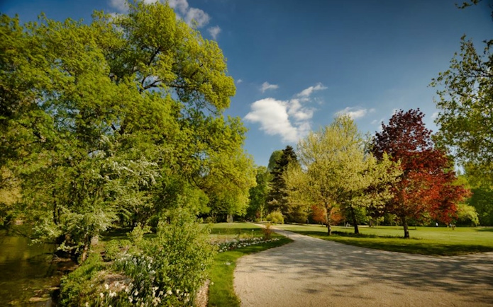 Pathway through lush gardens in Loire Valley, France.