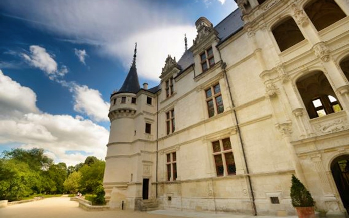 Château Azay-le-Rideau facade with turret under a blue sky, Loire Valley, France.