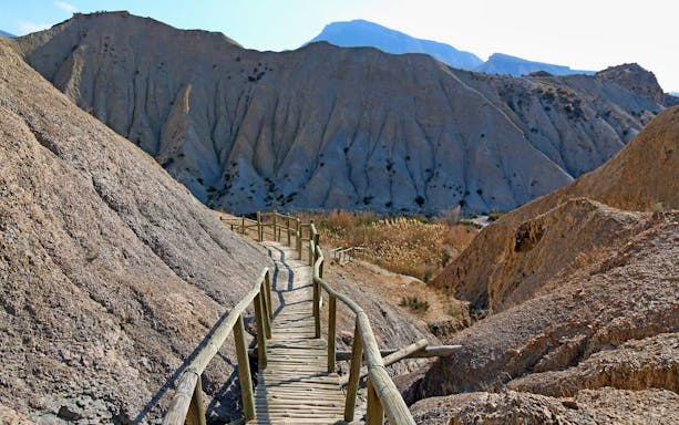 Wooden walkway through Tabernas Desert landscape on Western Movie Locations Walking Tour, Almeria.