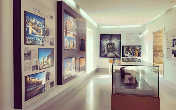 Museum exhibit in Almeria featuring historical photographs and architectural models.