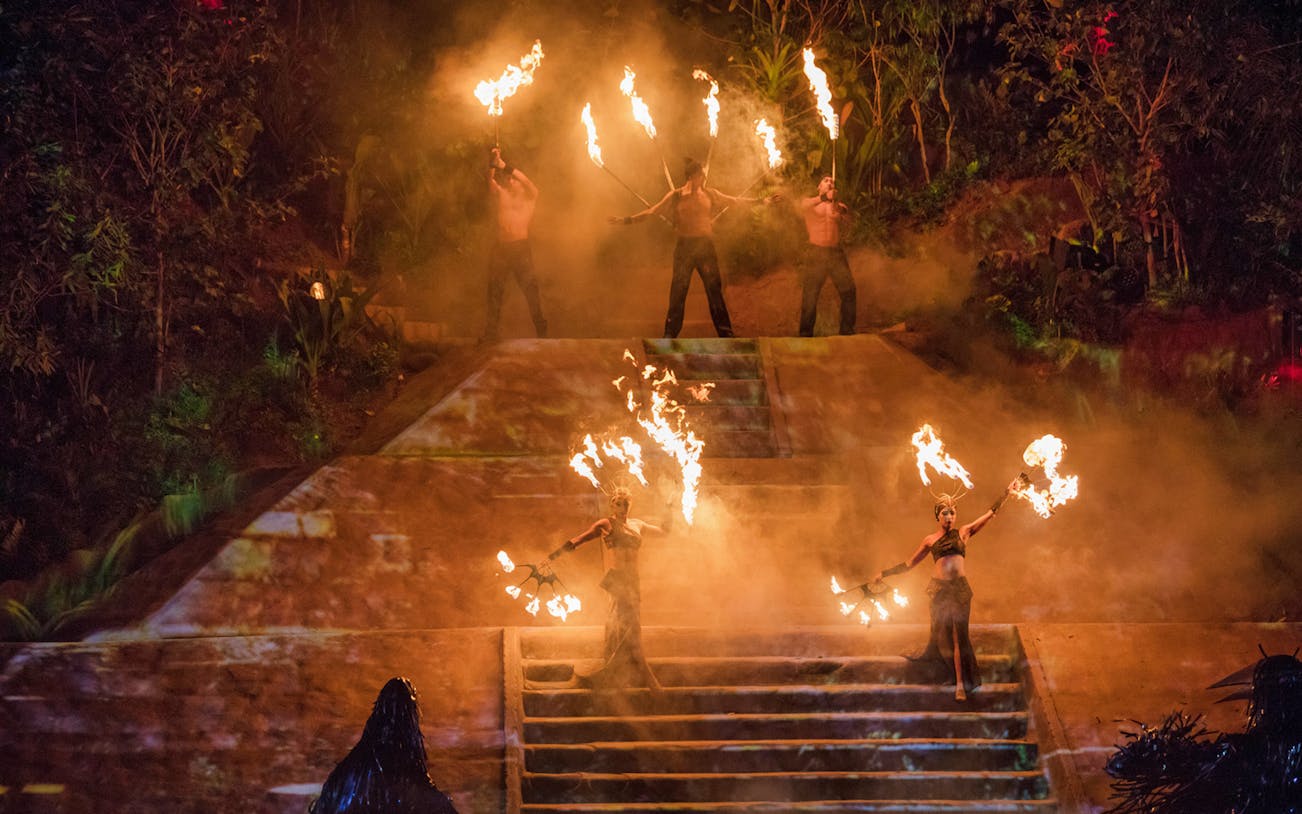 Fire performers on stage during Rhythms of the Night: VIP Dinner Show in Mexico.