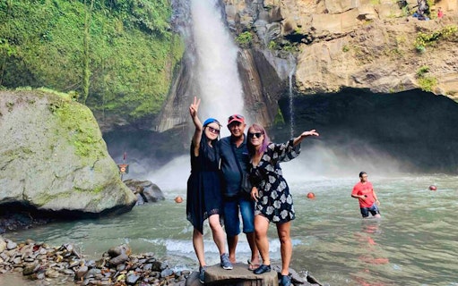Visitors enjoying Tegenungan Waterfall in Ubud, Bali during the Best Ubud Tour.