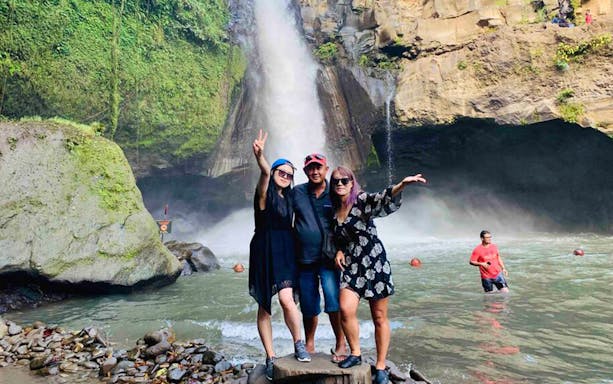 Visitors enjoying Tegenungan Waterfall in Ubud, Bali during the Best Ubud Tour.