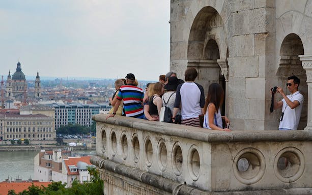 Tourists enjoying the view from Fisherman's Bastion on Gellért Hill, Budapest.