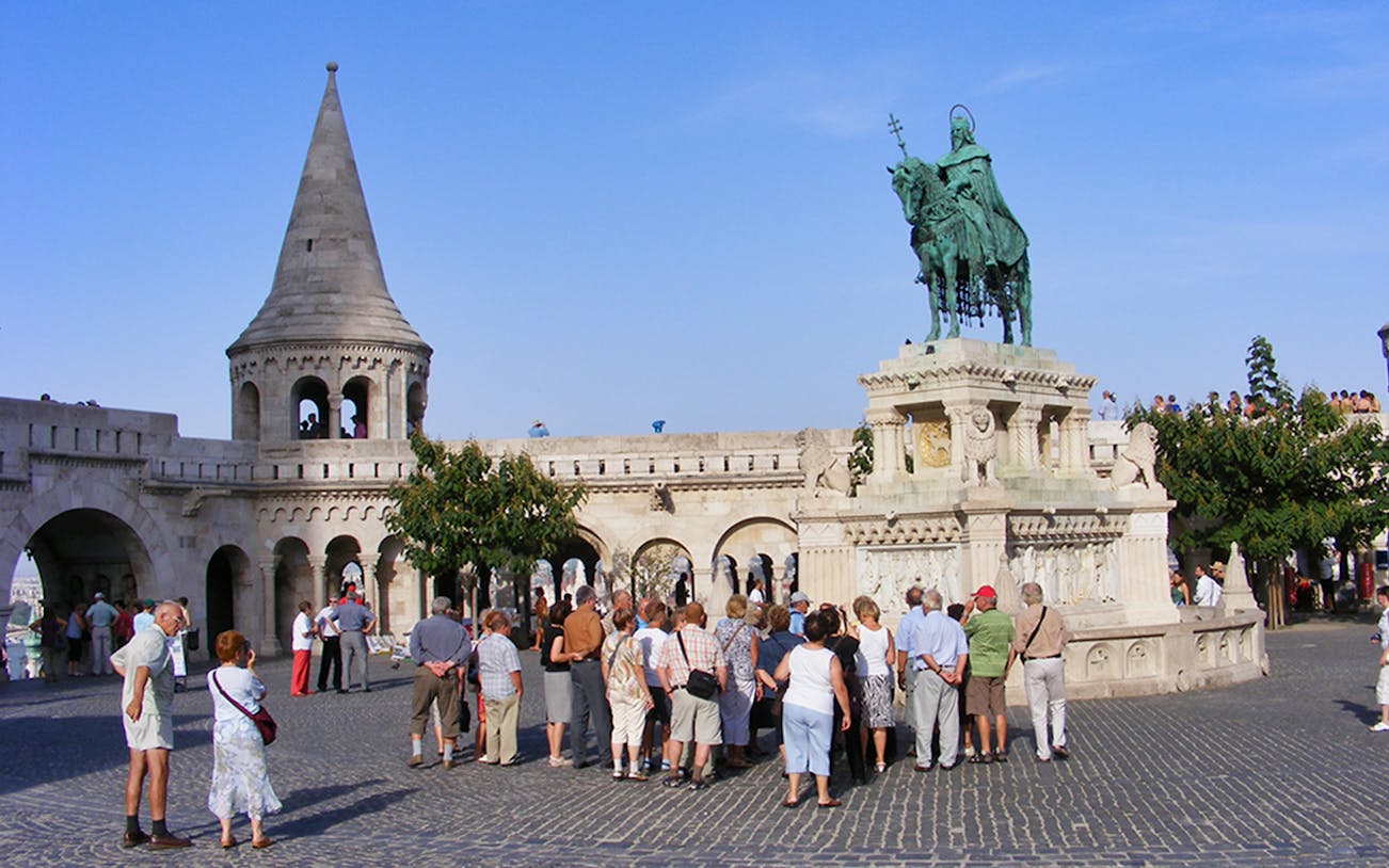 Tour group at Fisherman's Bastion, Budapest, viewing the statue of Stephen I.