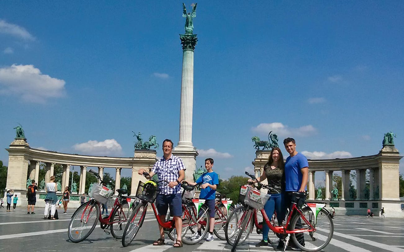 Cyclists at Heroes' Square during Budapest Small Group City Tour by Bike.