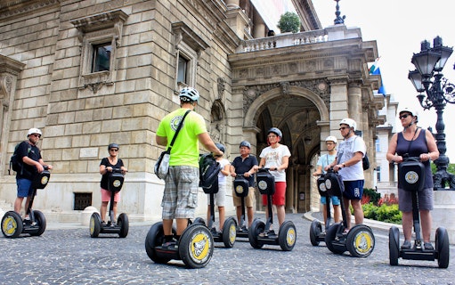 Group on Segways in front of historic building during Budapest City Park tour.