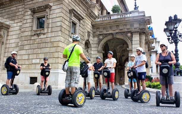 Group on Segways in front of historic building during Budapest City Park tour.