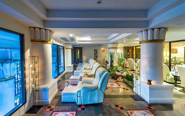 Luxurious massage chairs in Let's Relax Thai Massage spa setting.