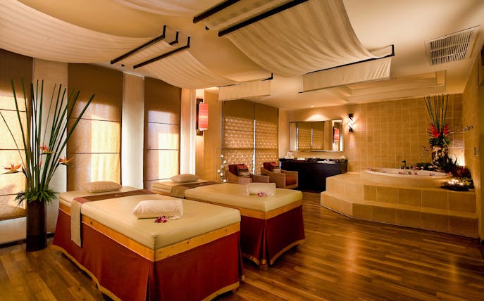 Spa room with two massage tables for Let's Relax Four Hands Thai Massage.