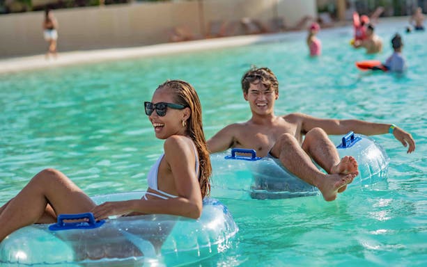 Visitors enjoying inflatable tubes at Blue Tree Water Park.