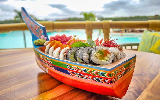 Sushi boat with assorted rolls at Blue Tree Water Park, Thailand.