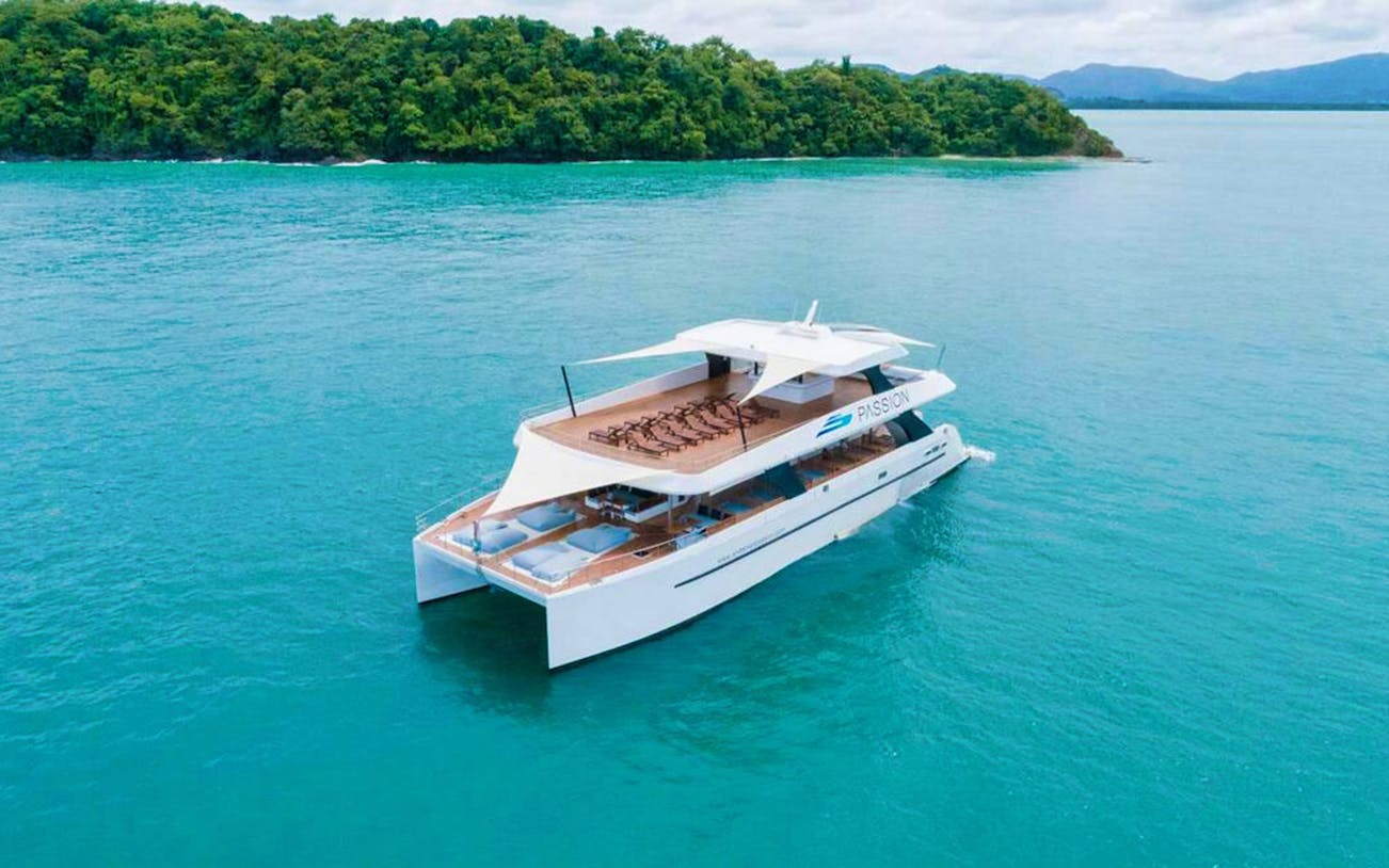 Catamaran sailing near Phi Phi Island for snorkeling tour at Long Beach.
